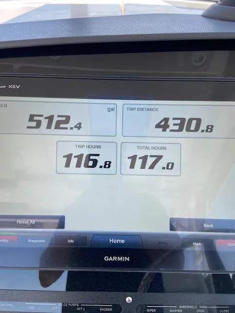 Slide: The Image of Garmin display showing fuel, trip distance, and hours on a 2019 Everglades 340 Dual Console. - 17