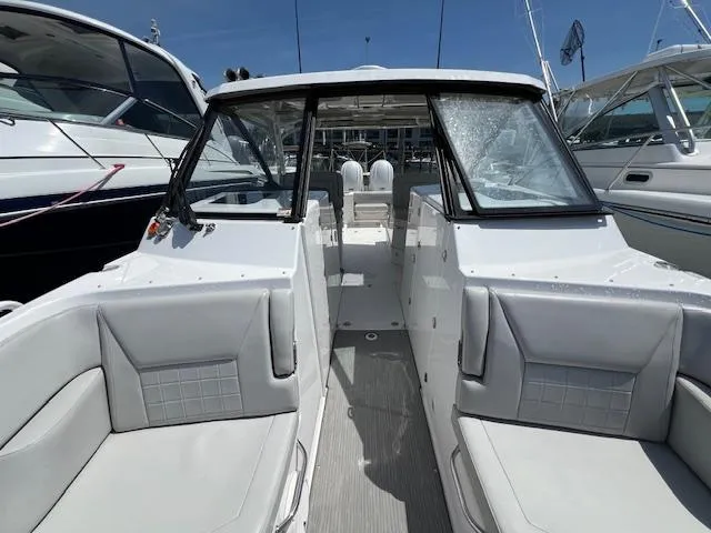 Slide: The Image of 2019 Everglades 340 Dual Console boat with spacious seating and sleek design. - 9