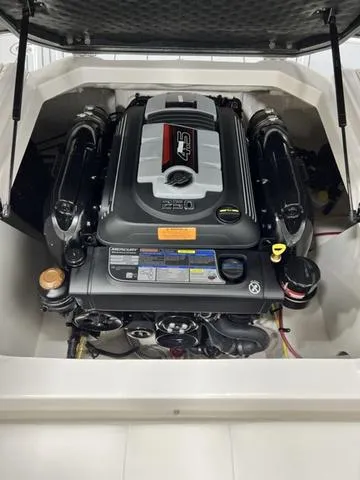 Slide: The Image of 2024 Chaparral 21 SSi boat engine compartment showcasing powerful engine design. - 13