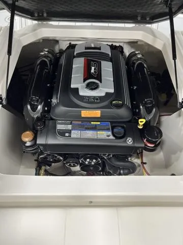 Slide: The Image of 2024 Chaparral 21 SSi boat engine compartment with powerful motor. - 14