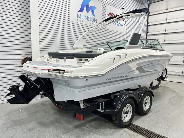 Slide: The Image of 2024 Chaparral 21 SSi boat on trailer in showroom, rear view. - 3