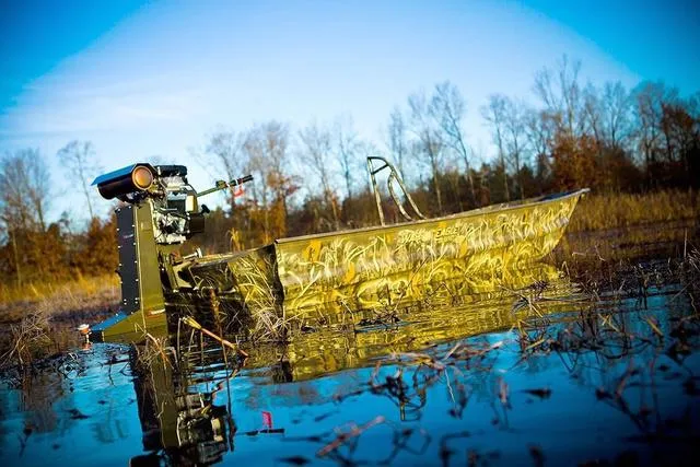 Slide: The Image of 2025 War Eagle 648 LDV 21" boat interior with camouflage pattern and textured flooring. - 14