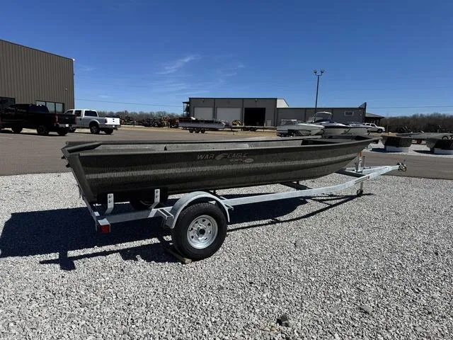 Slide: The Image of War Eagle 648 LDV 21" boat in marshland, 2025 model, camo design, outboard motor. - 4
