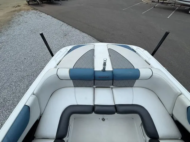 Slide: The Image of 2013 MasterCraft X45 boat interior with white and blue seating. - 8