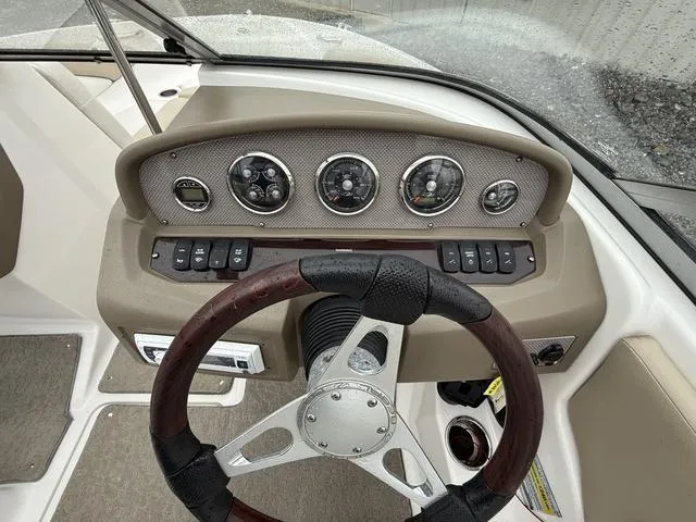 Slide: The Image of Steering console of a 2014 Regal 1900 ES boat with gauges and controls. - 14