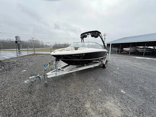 Slide: The Image of 2014 Regal 1900 ES boat on trailer in outdoor setting. - 4
