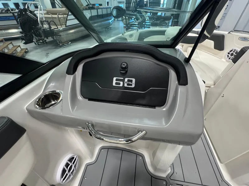Slide: The Image of 2025 Chaparral 21 SSi Ski & Fish boat dashboard with storage compartment. - 12