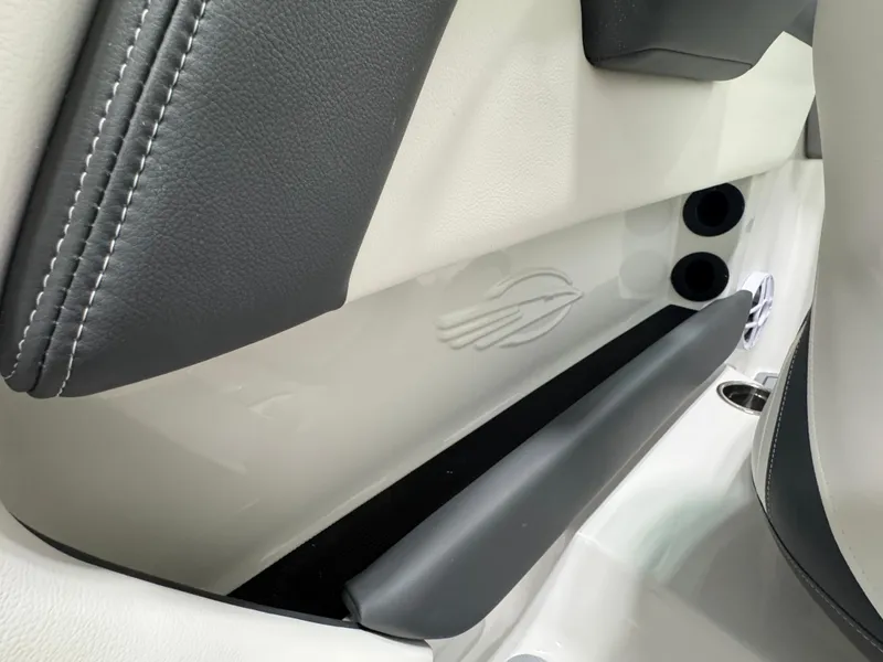 Slide: The Image of Interior detail of 2025 Chaparral 21 SSi Ski & Fish boat, featuring sleek design elements. - 14
