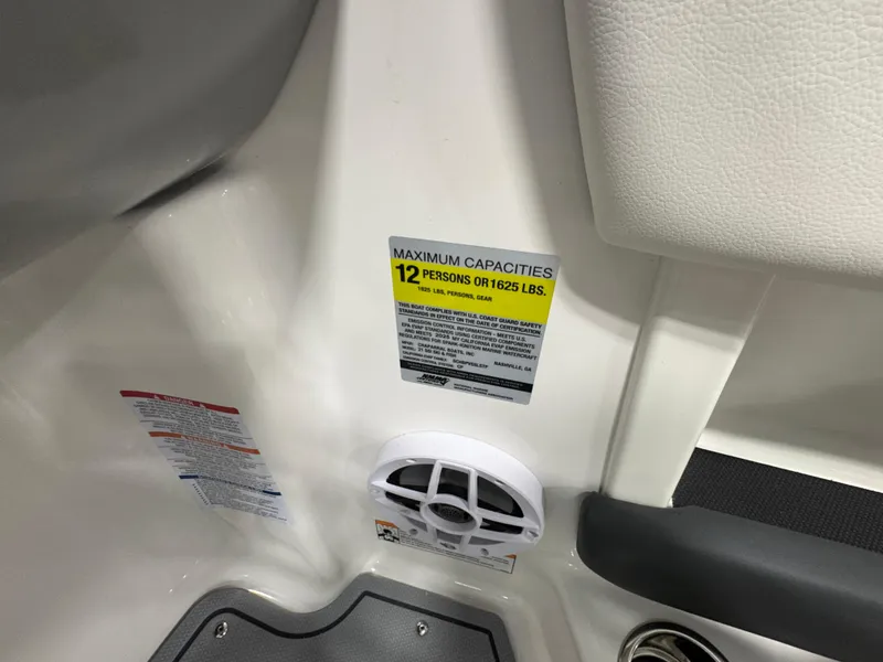 Slide: The Image of 2025 Chaparral 21 SSi Ski & Fish boat capacity label, maximum 12 persons or 1,625 lbs. - 9