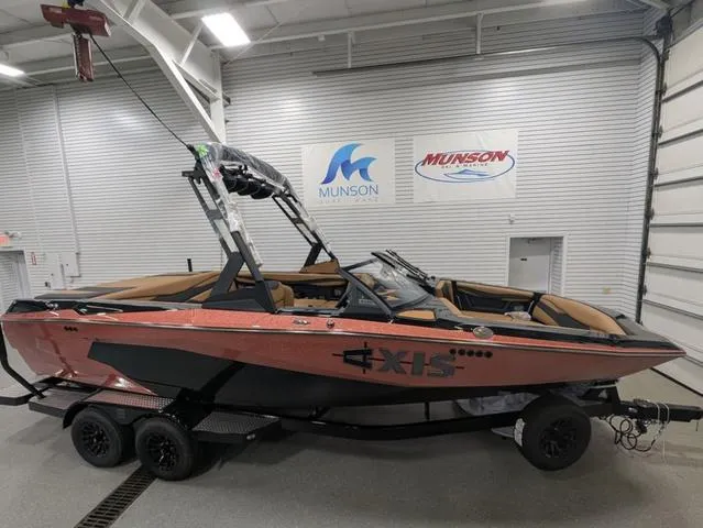 The Image of 2025 Axis Wake Research A225 boat in showroom, featuring sleek design and modern features. - 1