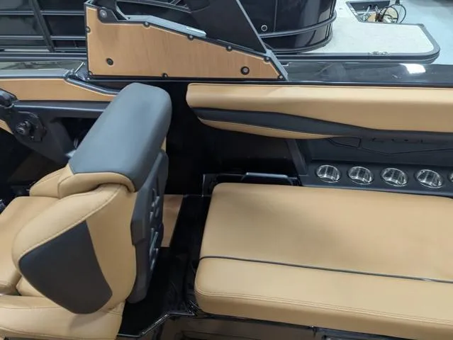 Slide: The Image of 2025 Axis Wake Research A225 interior with tan and black seating, modern design. - 15