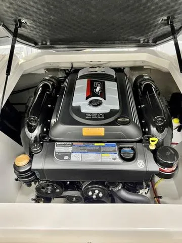 Slide: The Image of 2024 Chaparral 21 SSi engine compartment showcasing powerful marine engine. - 11