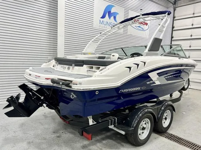 Slide: The Image of 2024 Chaparral 21 SSi boat on trailer in showroom setting. - 3