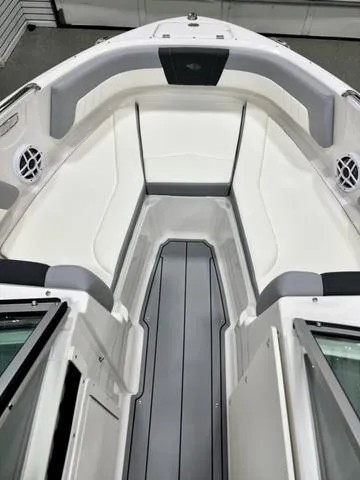 Slide: The Image of 2024 Chaparral 21 SSi boat interior with white and gray seating. - 6
