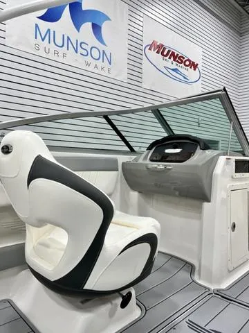 Slide: The Image of 2024 Chaparral 21 SSi boat interior with sleek design and modern dashboard. - 9