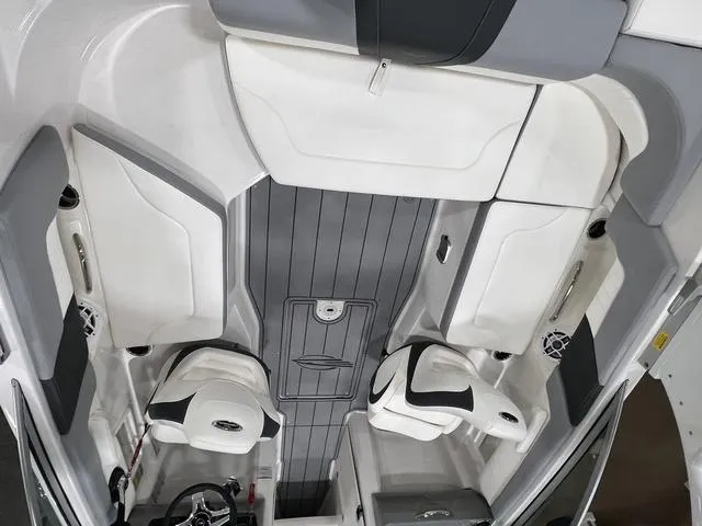 Slide: The Image of 2024 Chaparral 23 SSi boat interior with sleek seating and modern design. - 9
