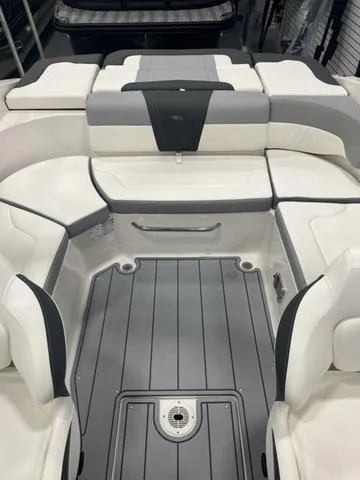 Slide: The Image of 2025 Chaparral 23 SSi boat interior with white and gray seating. - 10