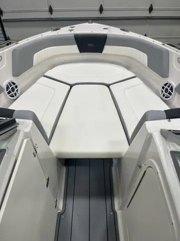 Slide: The Image of 2025 Chaparral 23 SSi boat interior with cushioned seating and sleek design. - 8