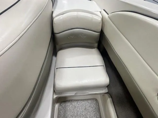Slide: The Image of 2005 Sea Ray 200 Signature boat interior with cushioned seating and sleek design. - 11
