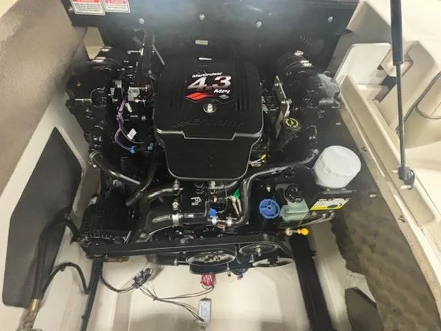 Slide: The Image of Engine compartment of a 2005 Sea Ray 200 Signature boat, featuring a MerCruiser 4.3 MPI engine. - 14