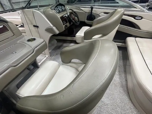 Slide: The Image of Interior of 2005 Sea Ray 200 Signature boat with beige seating and dashboard. - 20