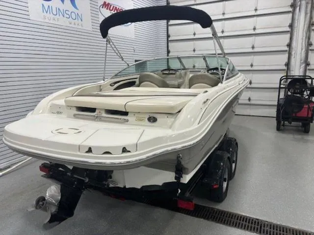 Slide: The Image of 2005 Sea Ray 200 Signature boat in showroom, on trailer, with canopy. - 22