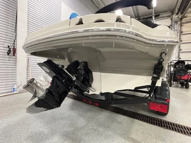 Slide: The Image of 2005 Sea Ray 200 Signature boat on trailer, rear view in a garage setting. - 23