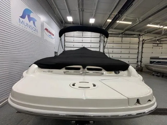 Slide: The Image of 2005 Sea Ray 200 Signature boat in showroom, covered and ready for display. - 25
