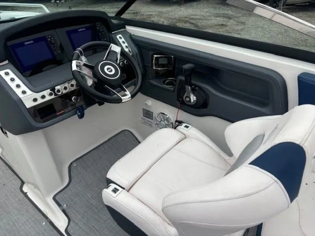 Slide: The Image of 2019 Chaparral 277 SSX boat cockpit with steering wheel and control panel. - 11