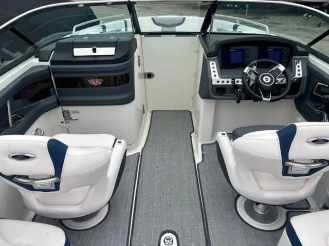 Slide: The Image of 2019 Chaparral 277 SSX boat interior with dual captain seats and modern dashboard. - 12