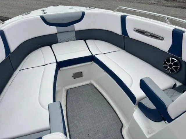 Slide: The Image of 2019 Chaparral 277 SSX boat interior with white and blue seating. - 13