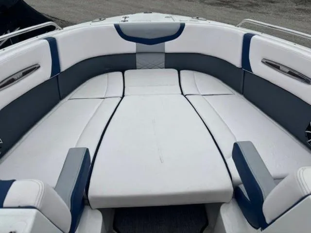 Slide: The Image of 2019 Chaparral 277 SSX boat interior with white and blue seating. - 14