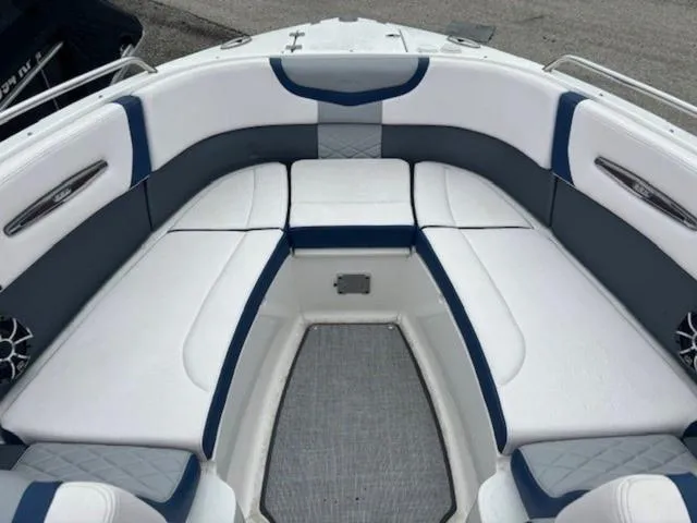 Slide: The Image of 2019 Chaparral 277 SSX boat interior with white and blue seating. - 16