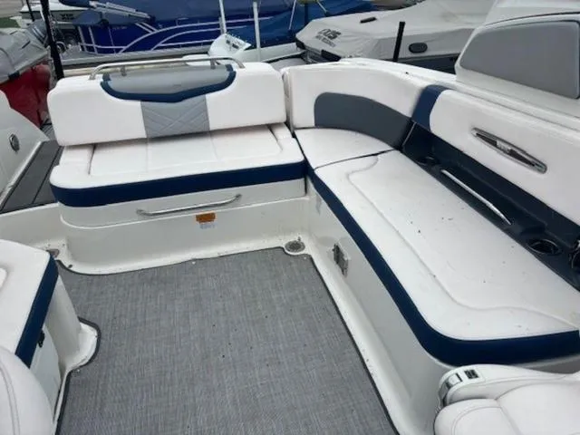 Slide: The Image of 2019 Chaparral 277 SSX boat interior with white and blue seating. - 17