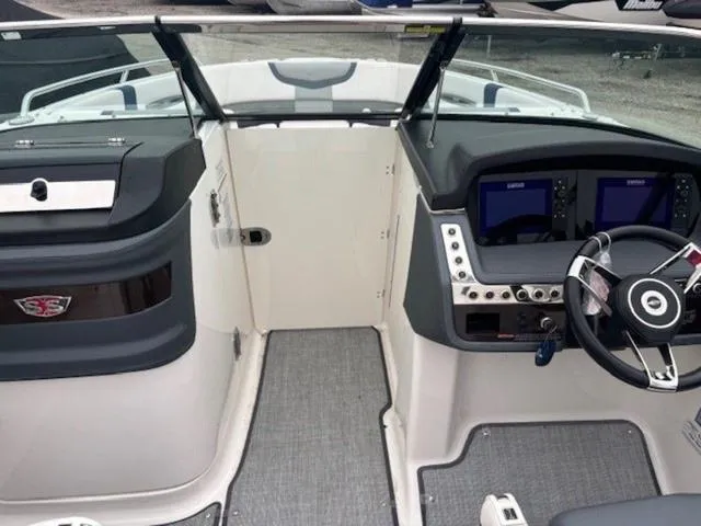 Slide: The Image of 2019 Chaparral 277 SSX boat cockpit with steering wheel and control panels. - 20
