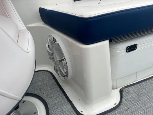 Slide: The Image of 2019 Chaparral 277 SSX boat interior with speaker and cushioned seating. - 25