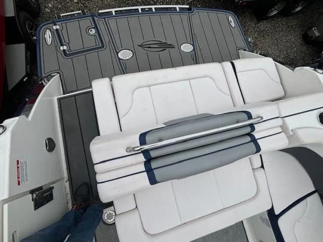 Slide: The Image of 2019 Chaparral 277 SSX boat interior with white seating and gray deck. - 26