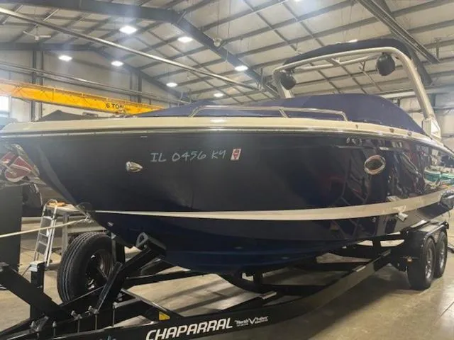 Slide: The Image of 2019 Chaparral 277 SSX boat on trailer in indoor facility. - 28