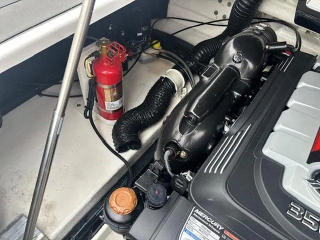 Slide: The Image of Engine compartment of 2019 Chaparral 277 SSX with fire extinguisher and Mercury engine. - 33