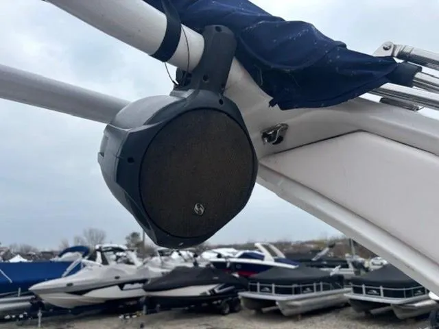 Slide: The Image of Close-up of a speaker on a 2019 Chaparral 277 SSX boat, with other boats in the background. - 34