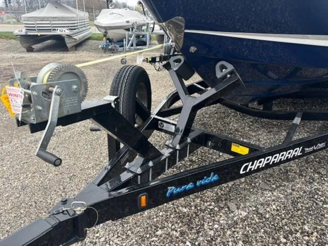 Slide: The Image of 2019 Chaparral 277 SSX boat trailer with winch, parked on gravel. - 41