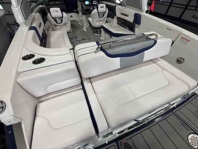 Slide: The Image of 2019 Chaparral 277 SSX boat interior with white seating and modern dashboard. - 43
