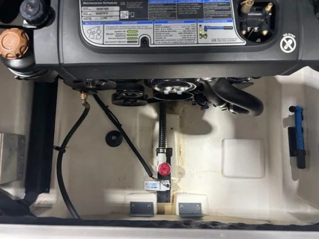 Slide: The Image of Engine compartment of 2019 Chaparral 277 SSX boat, showing maintenance schedule and components. - 47