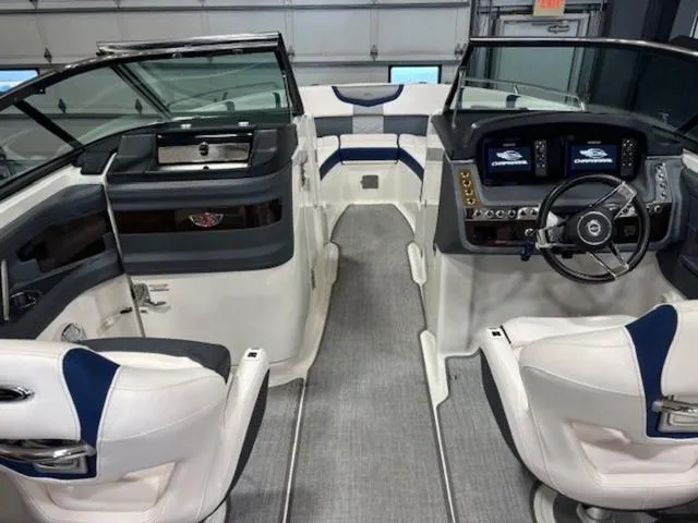 Slide: The Image of 2019 Chaparral 277 SSX boat interior with modern dashboard and seating. - 48