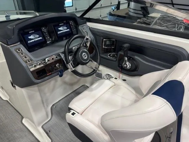 Slide: The Image of 2019 Chaparral 277 SSX boat cockpit with modern controls and comfortable seating. - 49