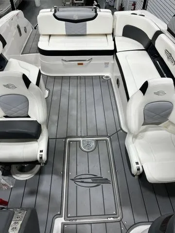 Slide: The Image of 2022 Chaparral 28 Surf boat interior with sleek seating and modern design. - 11