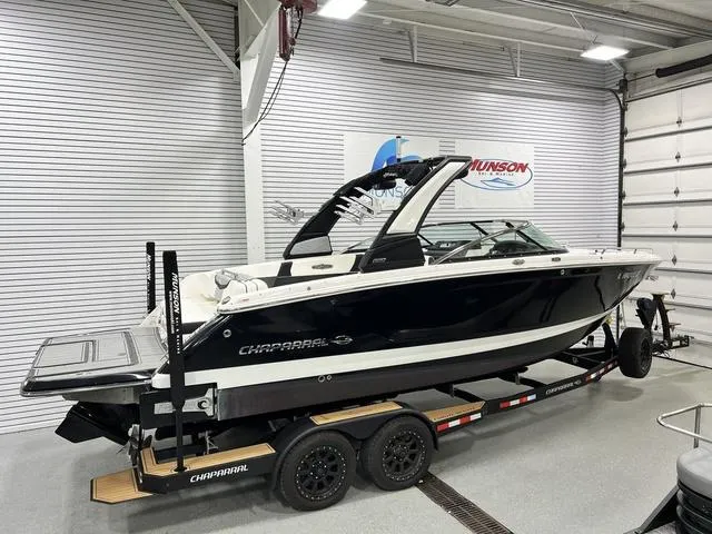 Slide: The Image of 2022 Chaparral 28 Surf boat on trailer in indoor showroom. - 4
