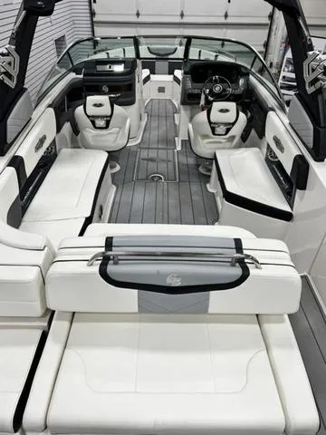 Slide: The Image of 2022 Chaparral 28 Surf boat interior with luxurious seating and modern design. - 8