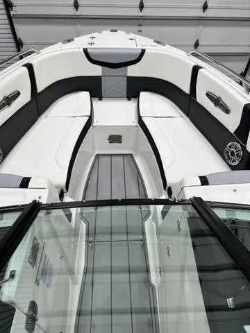 Slide: The Image of 2022 Chaparral 28 Surf boat interior with sleek seating and modern design. - 9