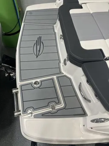Slide: The Image of 2022 Chaparral 23 SSi boat deck with gray padding and logo detailing. - 3